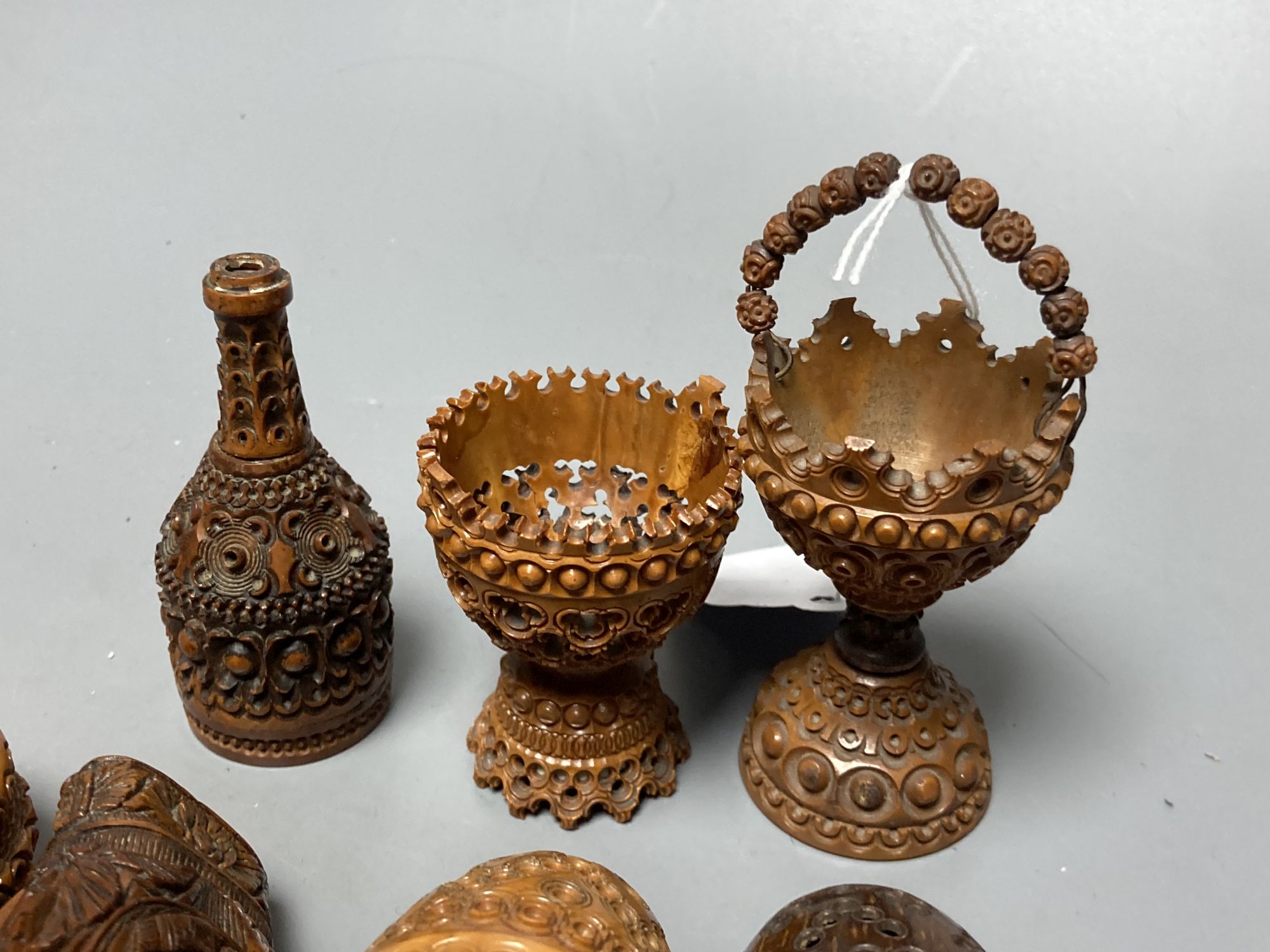 A quantity of coquilla nut carvings